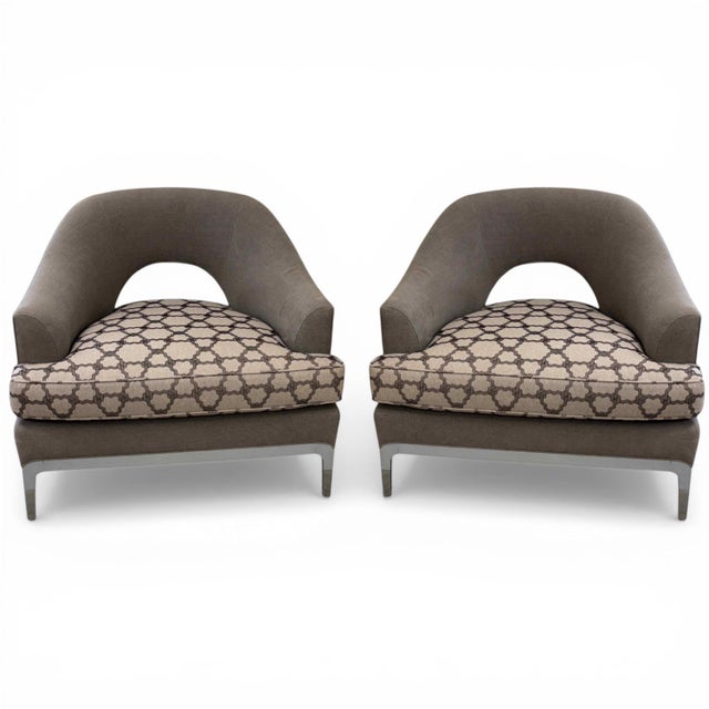 A pair of Baker Furniture Carnelian lounge chairs, designed by Jean-Louis Deniot. Each chair features a sculptural frame...
