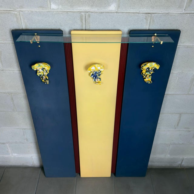 A rare, monumental, and prestigious Italian high-modernist wall coat rack, attributed to the celebrated collaboration...