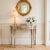A sophisticated demilune console table by Maitland-Smith, featuring a Neoclassical silhouette and hand-applied distressed...