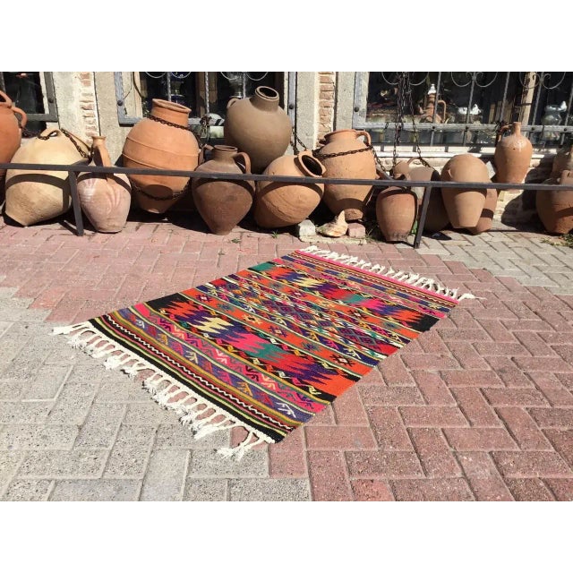 This beautiful, vintage, handwoven kilim is approximately 60 years old. It is handmade, of very fine quality hand spun...