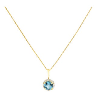 10K Yellow Gold Blue Topaz and 1/10 Cttw Diamond Accent Halo Pendant Necklace For Sale