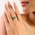 This handcrafted stackable wave ring is made in 925 sterling silver and features natural emerald gemstones with a total...