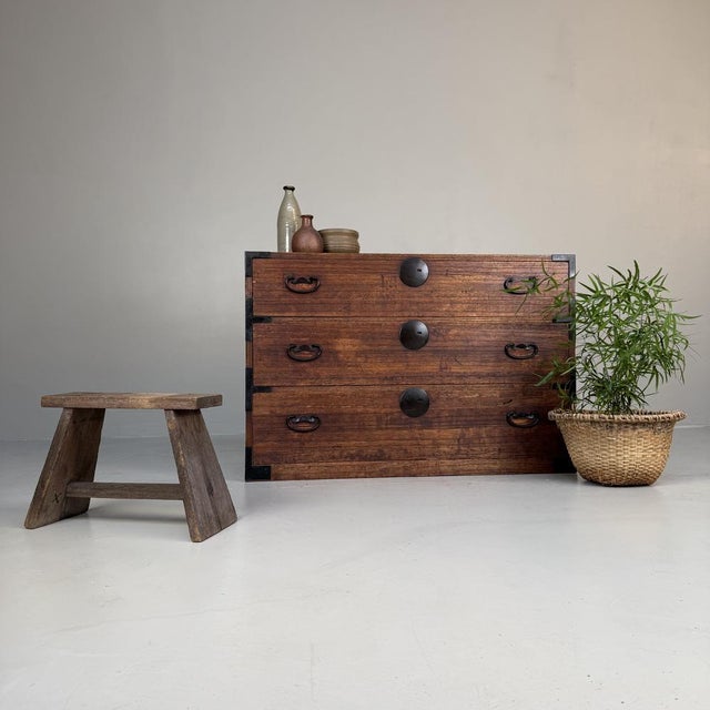 A characterful Japanese tansu from the Meiji period, composed of three spacious drawers and crafted in beautifully aged...