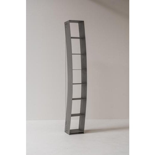 Pentagon bookshelf designed by Wolfgang Laubersheimer, a striking example of late 20th-century minimal design. Crafted...