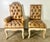 et of eight French Provincial style dining chairs, featuring two armchairs and six side chairs upholstered in distressed...