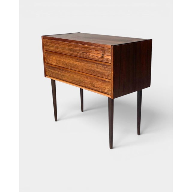 Elegant compact Danish chest of drawers from the 1960s, representing the clean lines and refined proportions...