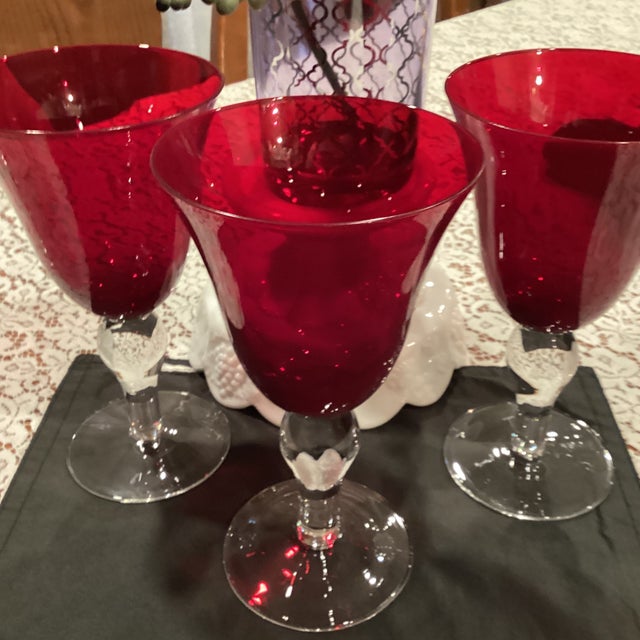 Beautiful Ruby Red Wine Goblets. Withred top sculpture and a clear stem with a lovely ball design that were hand blown....