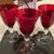 Beautiful Ruby Red Wine Goblets. Withred top sculpture and a clear stem with a lovely ball design that were hand blown....
