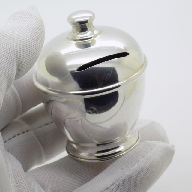 A small decorative money box crafted in Italy during the 1990s or 2000s. Hallmarked 800 which stands for Continental...