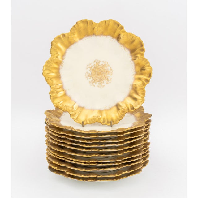 Set of Limoges Gilt Decorated Porcelain Tableware Pieces, comprising: (12) twelve salad plates, (12) twelve fruit bowls,...