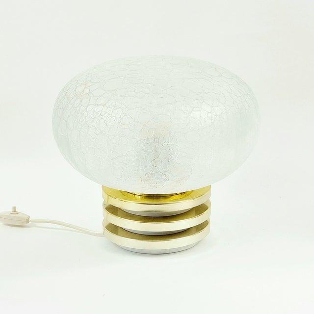 Wonderful mid-century/space age table lamp from doria, germany, 1960s. The mouth-blown frosted ice glass shade casts a...