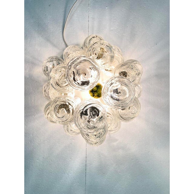 1 ceiling lamp from the 1960s and 1970s, 7-light bulbs, E14 socket. White lacquered metal, glass, and brass. Good used...