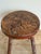 This is an early 20th century primitive round stool set on 4 simple legs. The thick, solid circular wooden top has heavy...