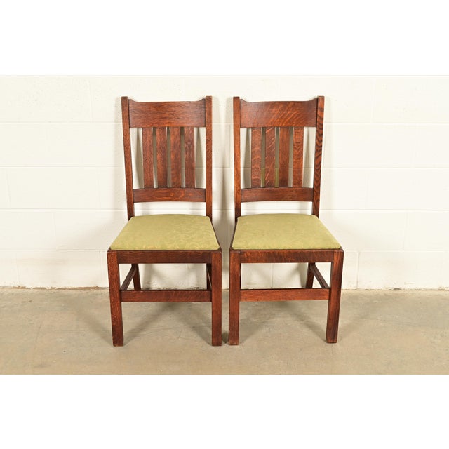 A gorgeous pair of antique Mission or Arts & Crafts side chairs or dining chairs In the manner of Stickley Brothers USA,...