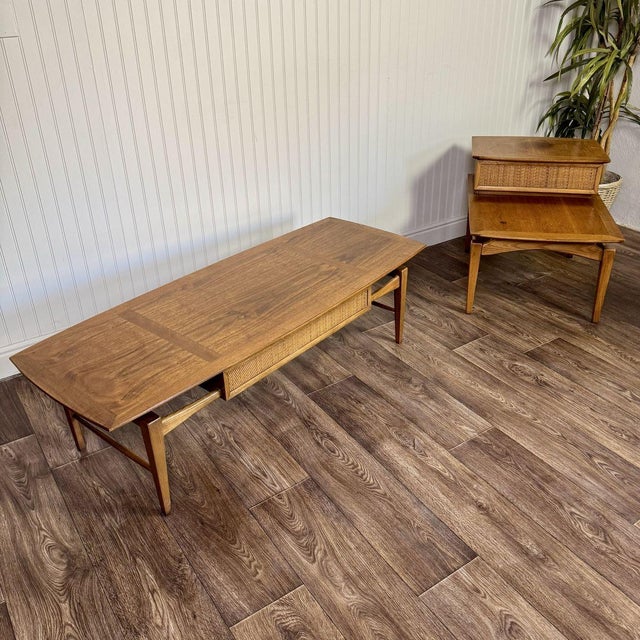 Vintage Lane Esteem coffee table and step end table set in walnut with woven cane drawer fronts, designed by André Bus and...