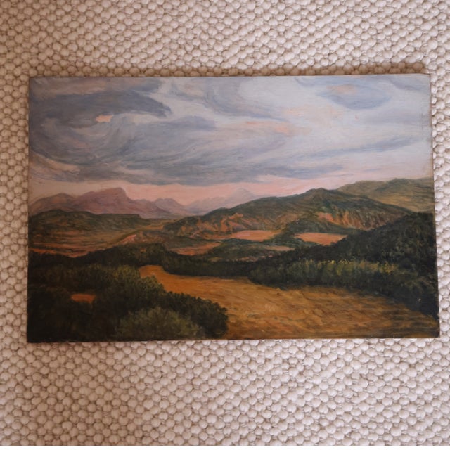 20th Century French Mountain Scene Painting depicting a sweeping, atmospheric landscape of rolling hills and distant peaks...