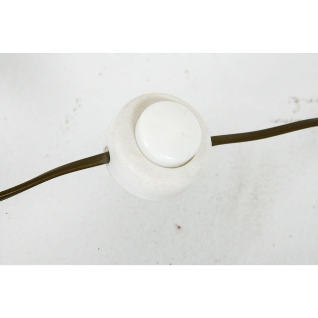 Bring an authentic slice of 1970s European design into your space with this striking three-light floor lamp, manufactured...