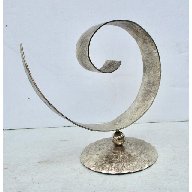 Taneez silver plate unique sculptural model. Curled and hand-textured surface and mounted to a circular base stand....