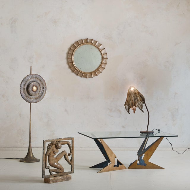 A striking 1970s Brutalist coffee table, attributed to Valenti, Barcelona. Crafted of solid cast bronze, the base is...