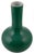 It features a classic bottle vase silhouette, characterized by a bulbous, rounded lower body that smoothly tapers upward...