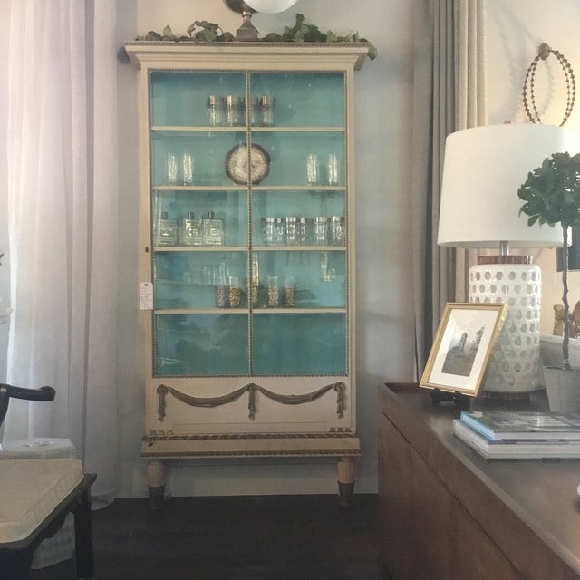 Striking Louis XVI era vitrine with Robin blue interior and original glass. Exterior has a cream finish with light patina....