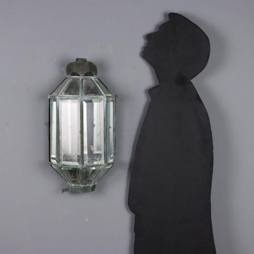 Lantern-shaped wall light made of sheet metal and beveled glass, one central light requiring re-electricity. Small...
