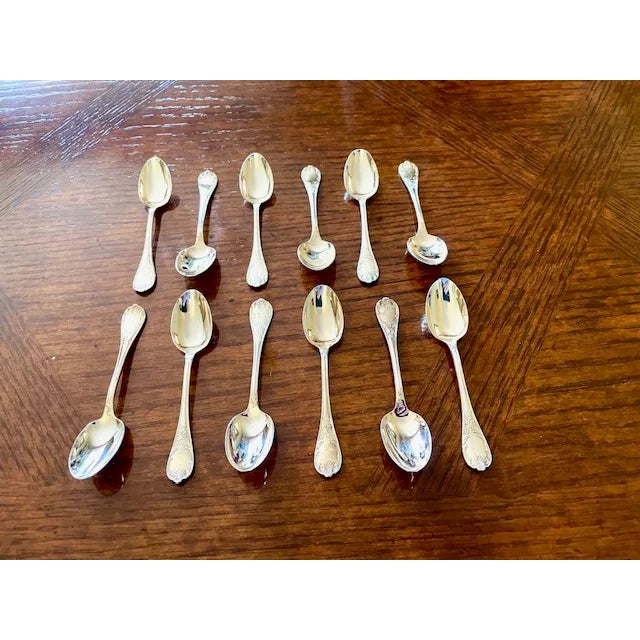 This vintage set of GUMPS of San Francisco silver plate demitasse spoons from the 1950s-1970s features a Victorian shell...