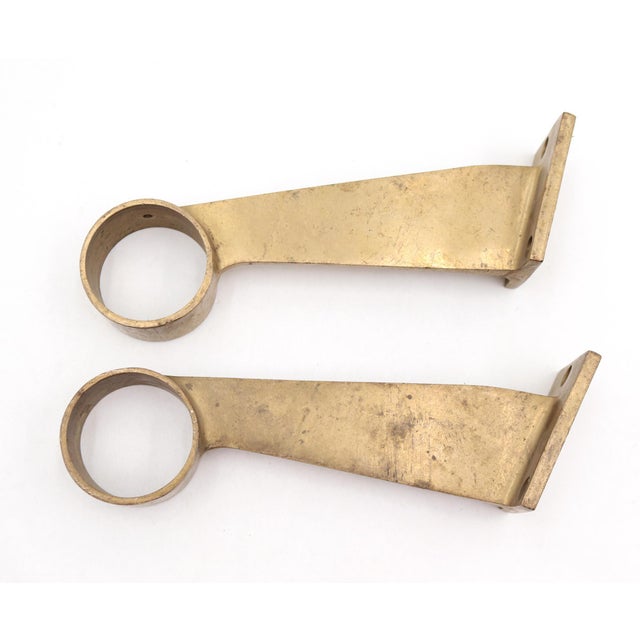 Reclaimed brass bar mount brackets designed to support rail tubing, commonly used for bar foot rails, handrails, or dance...