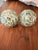 Set of two substantial mosaic decorative orbs featuring hand-laid glass tile in soft coastal tones of greens with white...