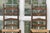 An honest pair of early American (likely classic New England or Mid-Atlantic colonial) dark-stained ladder-back side...