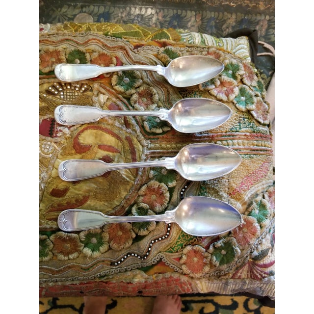 Rare San Francisco 19th century silversmith J W Tucker. Large and heavy spoon. Old monogram and crest features a lion.