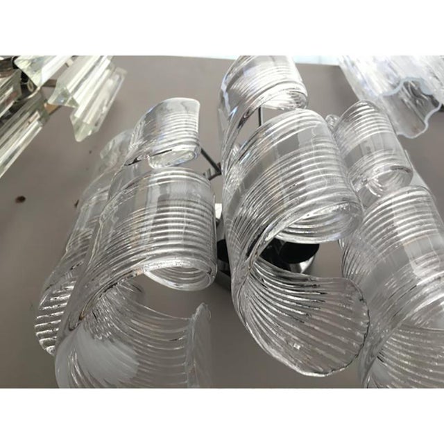 Transparent and white Murano Glass "spirale" wall sconce with a chrome metal frame. Spare parts included. 2 bulbs. width =...