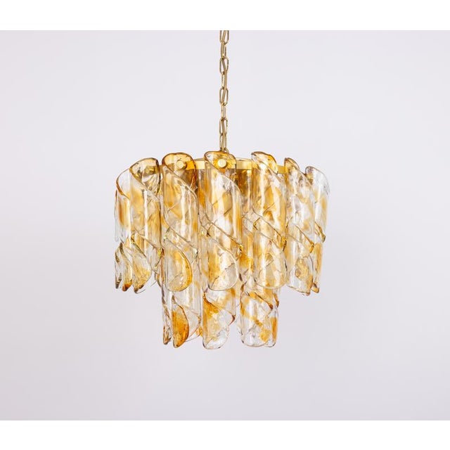 Fantastic mid-century chandelier by kaiser, germany, manufactured circa 1970-1979. A lot of murano glasses in swirl shape...