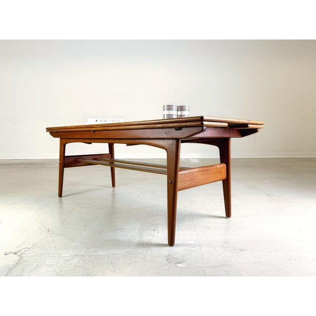 We offer for sale a beautiful Trioh coffee table from the 1960s. The table top can be adjusted in height from 54 to 68cm...