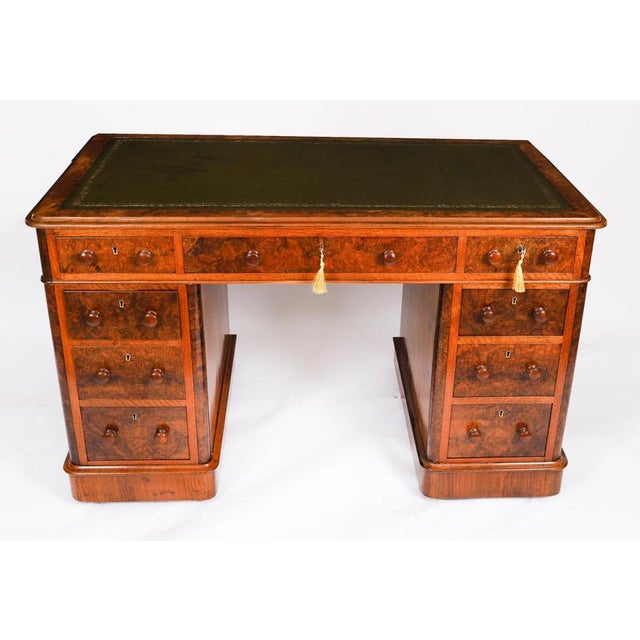 This is a fine antique Victorian burr walnut twin pedestal desk, Circa 1860 in date. It is made from fabulous burr walnut....