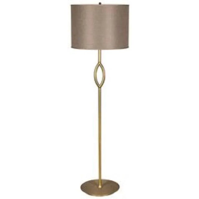 This elegantly angled metal floor lamp has been expertly artisan crafted and finished in antique brass. Its classic lines...