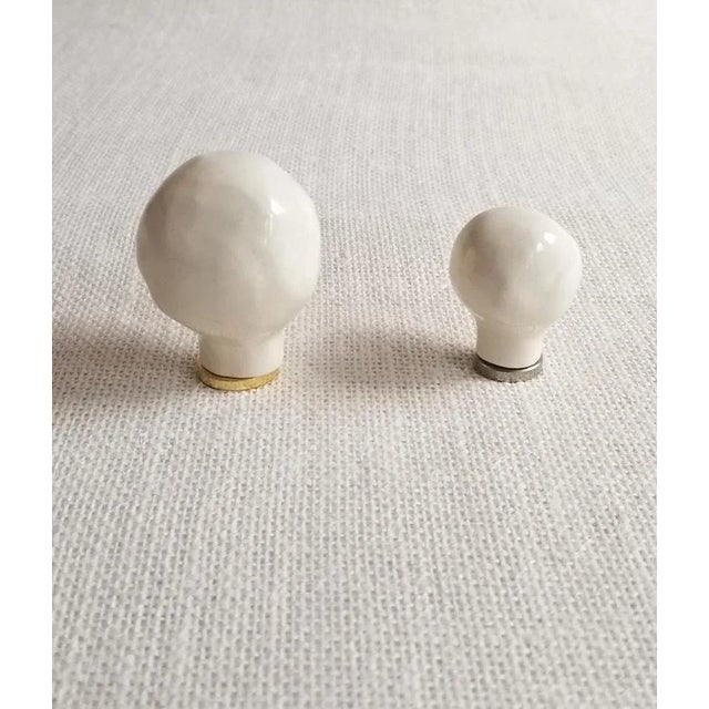 Pair of large round organic shaped ceramic lamp finials. These ceramic finials were first hand-formed in clay, then a mold...