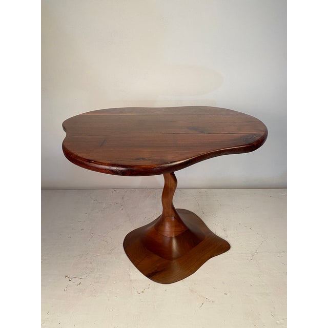 A lovely occasional table in stack laminated solid walnut. Abstract & organic in design. Made by a talented but unknown to...