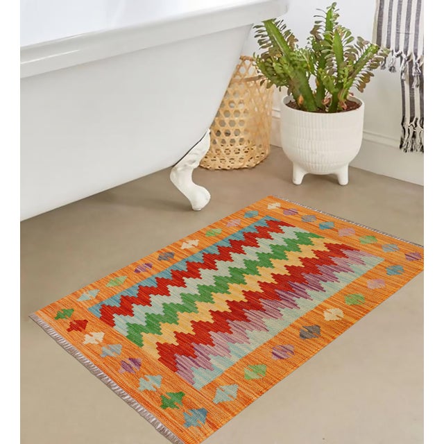 Elevate the elegance of your home with this stunning hand-woven tribal Kilim wool rug. Meticulously crafted on a loom by...