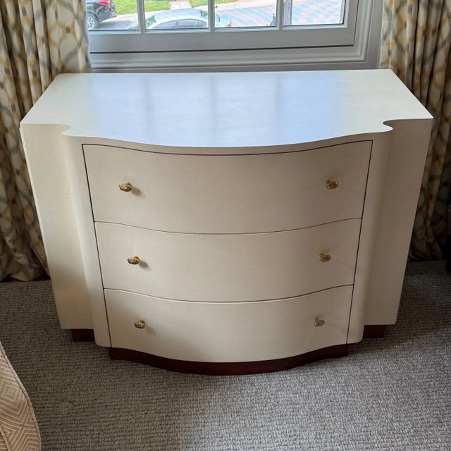 Kravet Furniture Chest Modern shape on a wood base with three generous drawers. Brass knobs bring a unique texture. 42”w x...