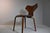The chair is made entirely of wood and was designed by Danish designer Arne Jacobsen for the Fritz Hansen company in the...
