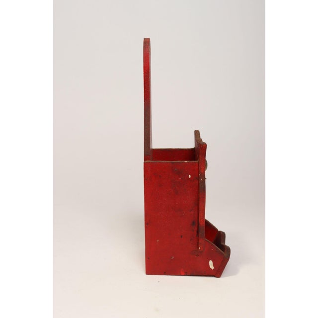 Hand-carved Folk Art matchbook holder with attached metal eyes and original hand-painted details (ca. 1940s, USA). Primary...