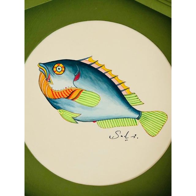 Hand-painted by our master artist using acrylic paints and natural pigments, this little fish is alive with joyful pops of...