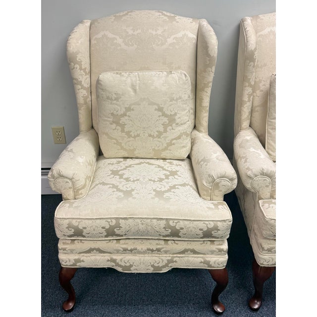 Pair of Masterfield Furniture wingback chairs, beautifully crafted in a timeless traditional style. Each chair features a...