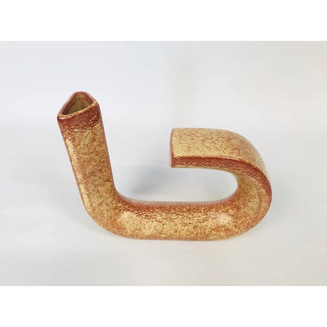 This sculptural loop-shaped vase was designed by Roberto Rigon for Bertoncello in Italy during the 1960s. The fine piece...