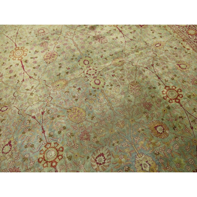 Circa 1920 persian tabriz rug in greens and ruby red