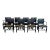A set of eight dining chairs from luxury furniture maker Dessin Fournir. Hand-carved walnut frames feature an ebonized...