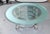 20th Century circular coffee table having a 1/2" thick glass top with acid etched border resting on a chrome base with...