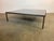 We offer for sale a beautiful and very large designer coffee table. The frame was handmade, which can be seen, among other...