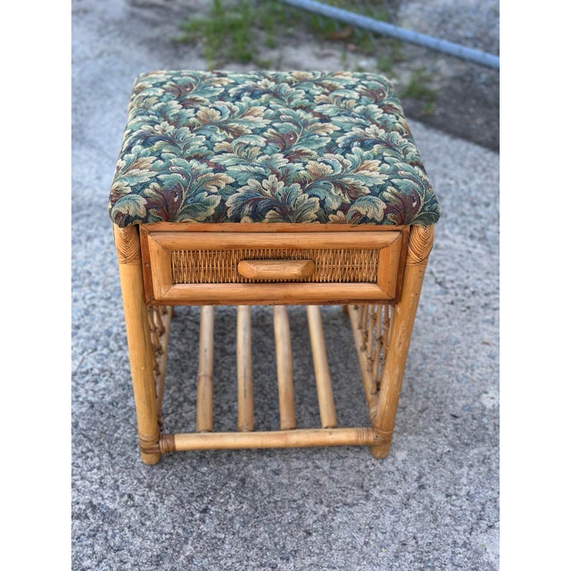 This charming vintage rattan side table combines tropical style with practical function. Crafted from warm honey-toned...